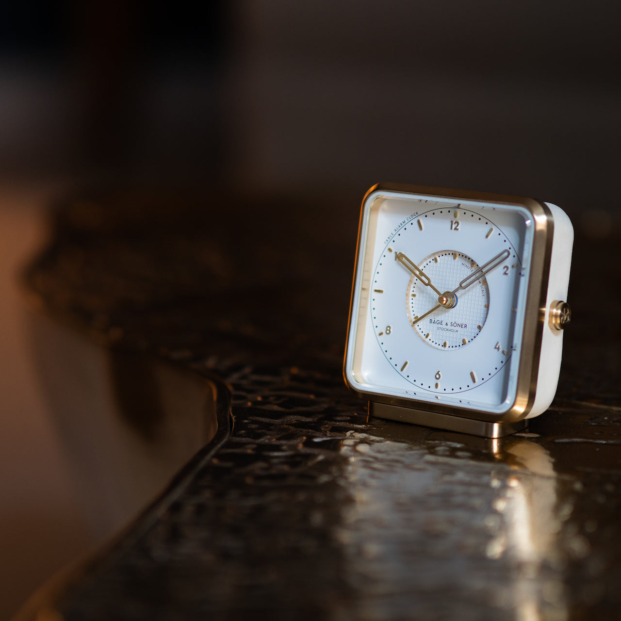 Elegant 'Morning Glory' alarm clock on a clean-lined nightstand, symbolizing pure elegance.