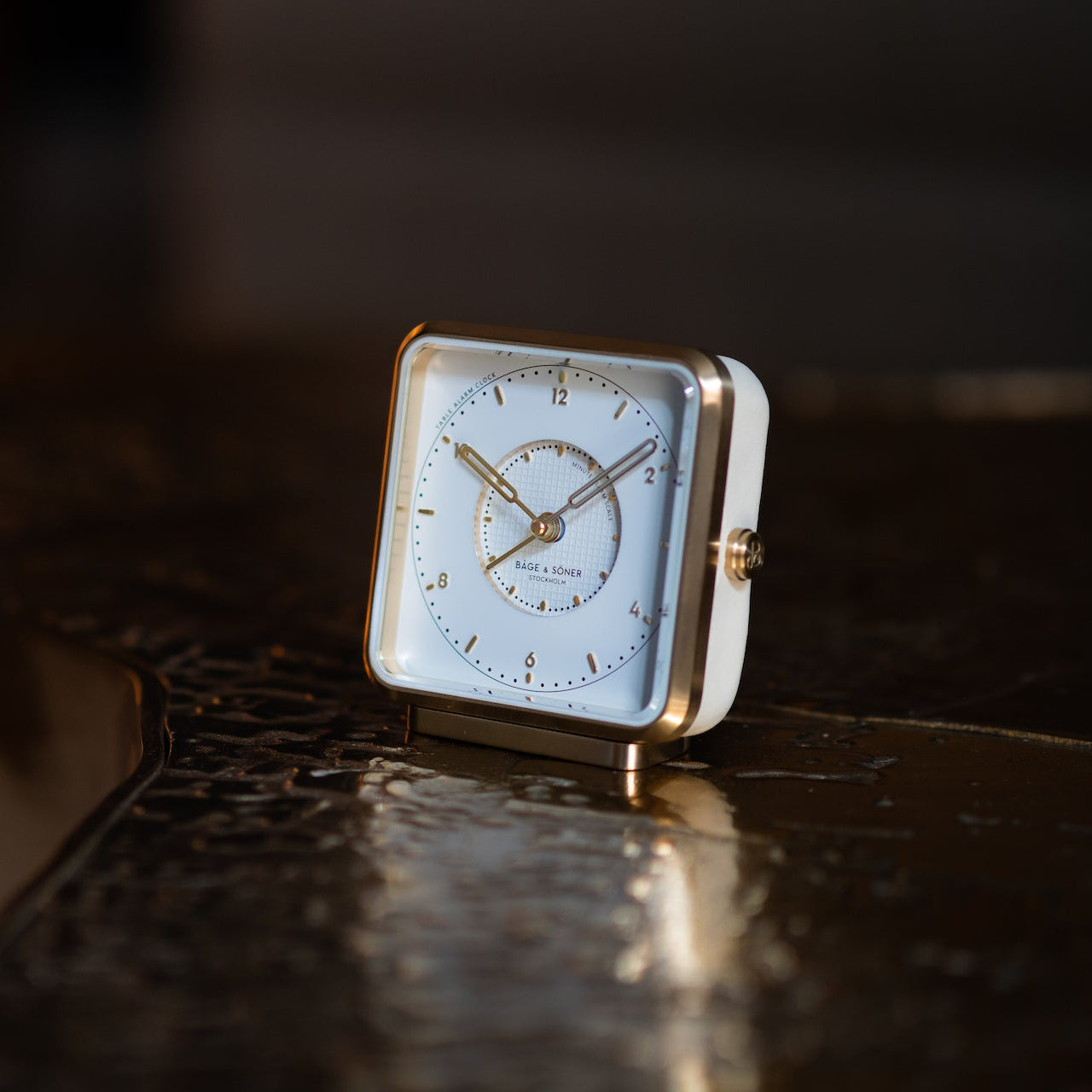 Elegant 'Morning Glory' alarm clock on a clean-lined nightstand, symbolizing pure elegance.