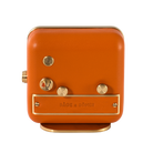 Rear view of 'Everglow' alarm clock showing the brushed gold-plated back and orange leather craftsmanship