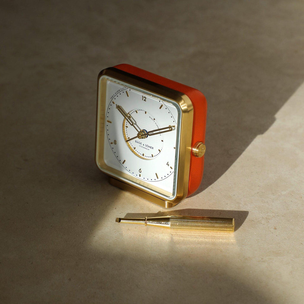 Everglow' alarm clock adding a touch of opulence to the home environment with its orange leather