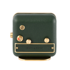 Green leather and brushed gold-plated steel frame the back of 'Forest Dream' alarm clock.