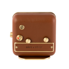 Backside of 'Happy Yawn' alarm clock, revealing the brushed gold-plated finish and cognac leather craftsmanship