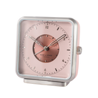 Magnolia-colored dial and silver numbers of 'Magnolia Memories' alarm clock, set within a matte-polished frame