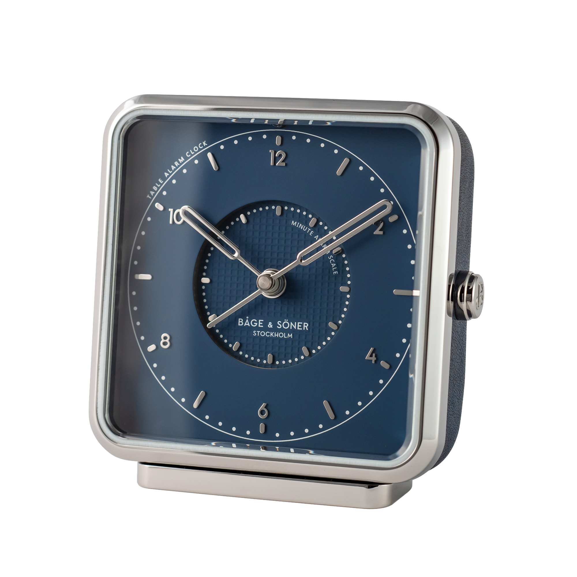 Sleek 'Northern Lights' alarm clock with a blue dial and silver numbers, paired with polished stainless steel