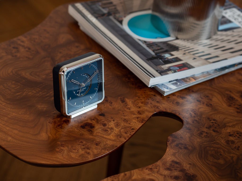 Northern Lights' alarm clock, the blue leather band capturing the essence of a clear night sky