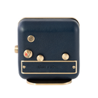 The brushed gold-plated steel and blue leather back of the 'Sea Breeze' alarm clock