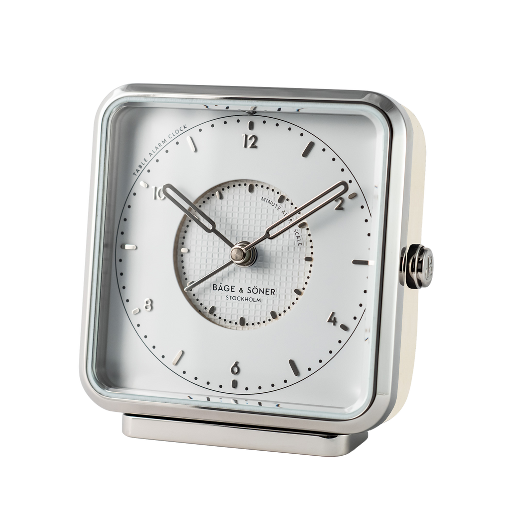 Refined 'Sleeping Beauty' alarm clock boasts a white dial with silver numbers and matte-polished edge