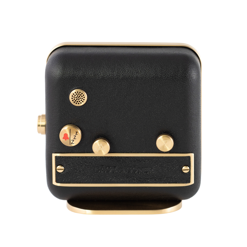 The back angle of 'Sleepy Rock' alarm clock, where luxurious black leather meets brushed gold plating