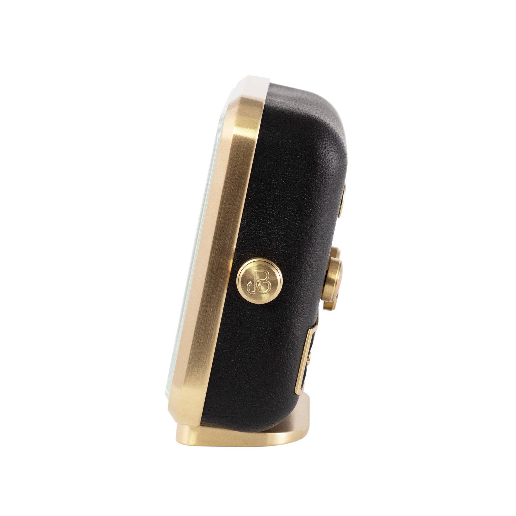 Brushed gold-plated frame against sleek black leather defines the 'Sleepy Rock' alarm clock's side view