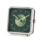 Sophisticated 'Whispering Woods' alarm clock with a green dial and silver numbers, enclosed by a matte-polished frame