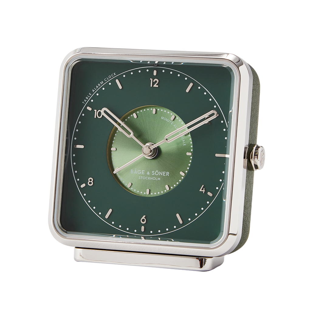 Sophisticated 'Whispering Woods' alarm clock with a green dial and silver numbers, enclosed by a matte-polished frame